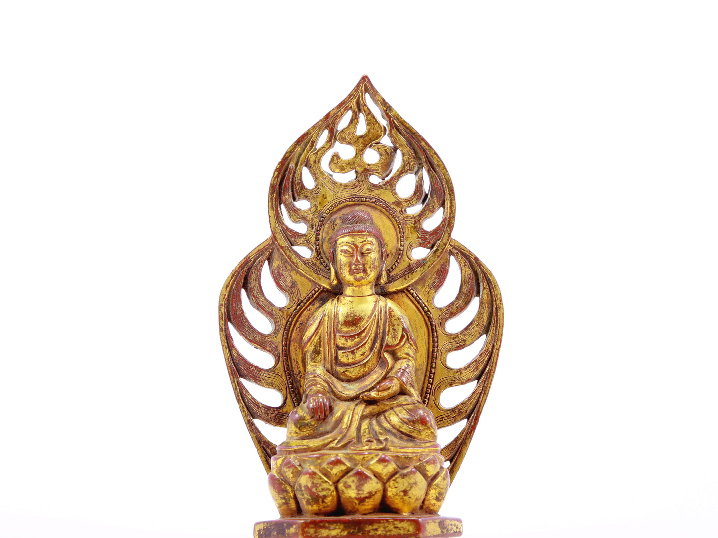 A serene gilt bronze statue of Gautama Buddha