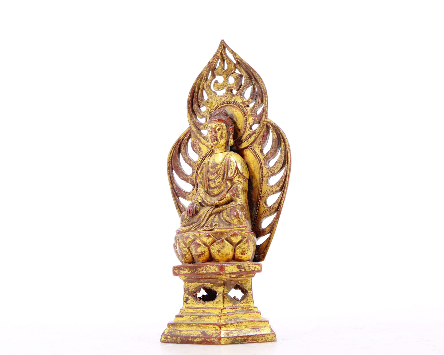 A serene gilt bronze statue of Gautama Buddha