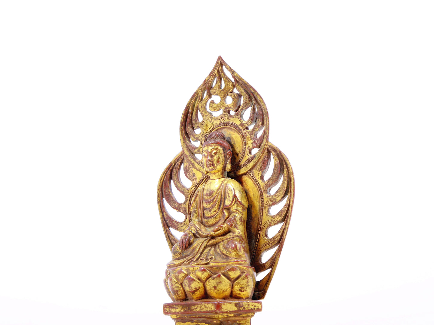 A serene gilt bronze statue of Gautama Buddha