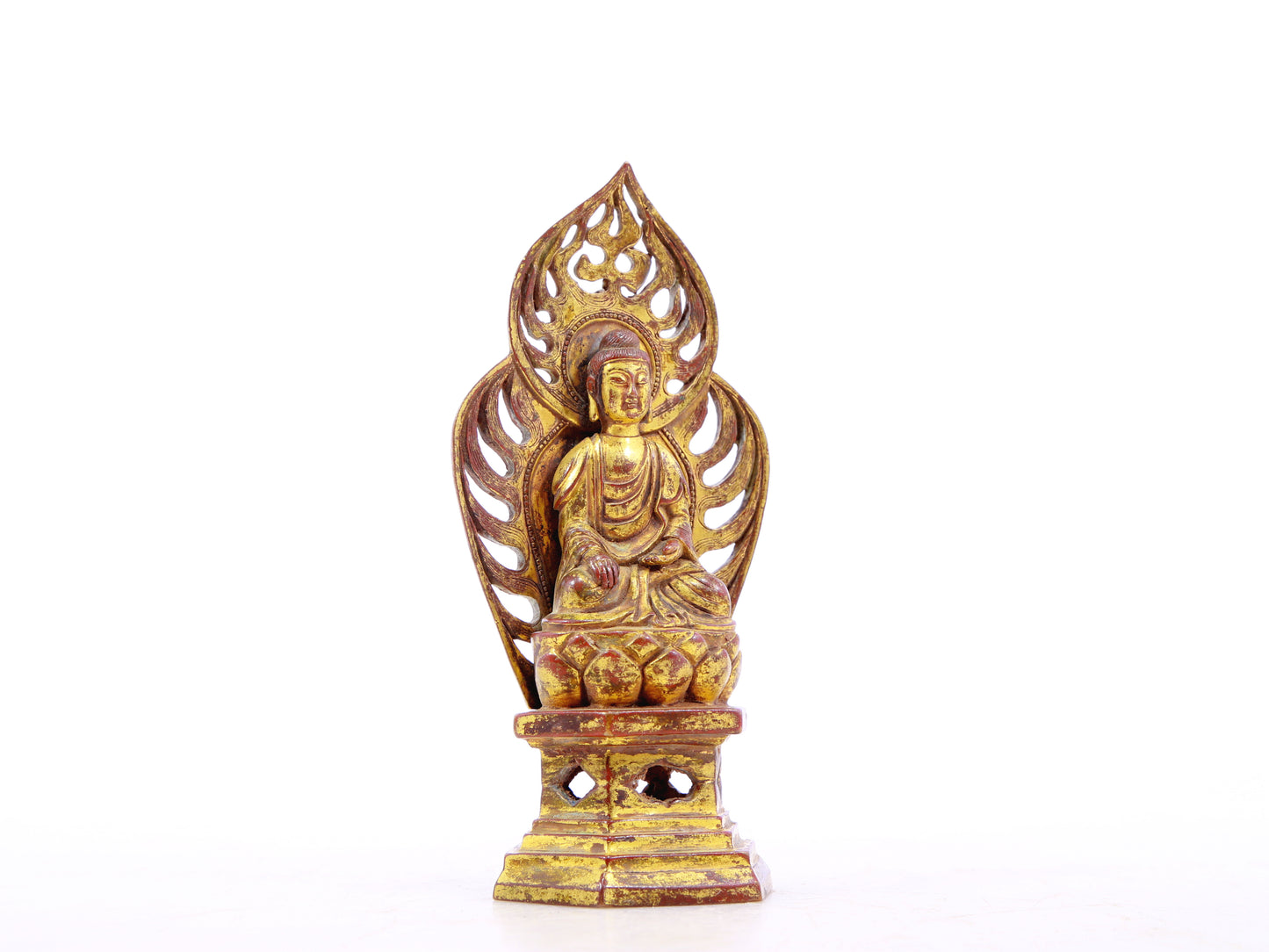 A serene gilt bronze statue of Gautama Buddha