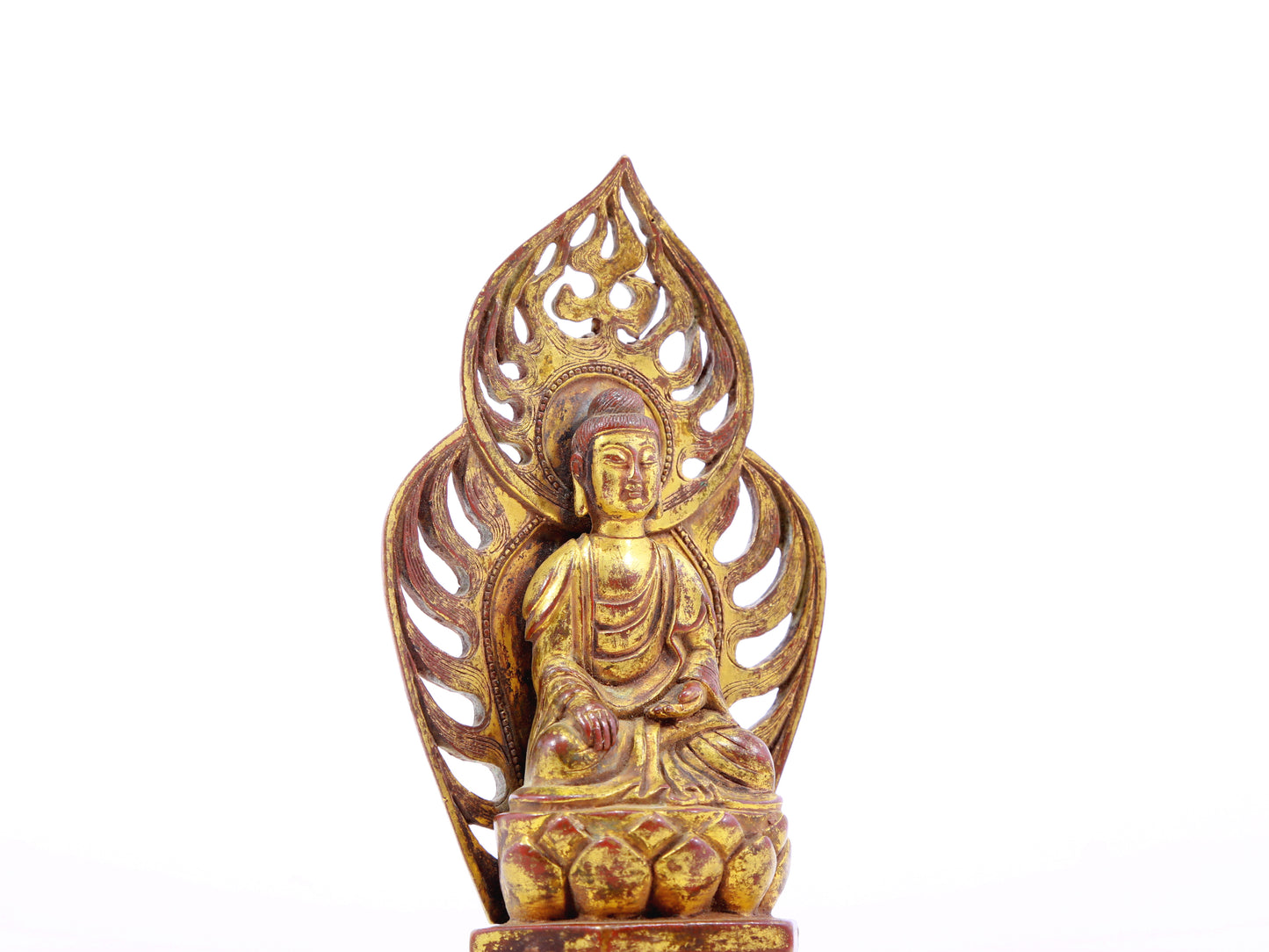 A serene gilt bronze statue of Gautama Buddha