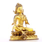 A serene gilt bronze statue of green Tara