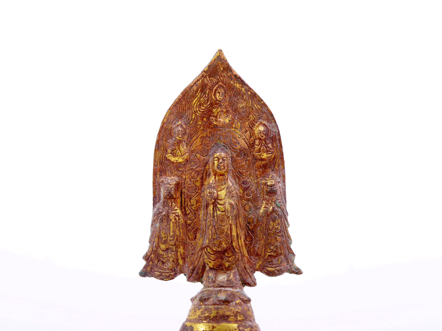 A serene gilt bronze statue of Gautama Buddha