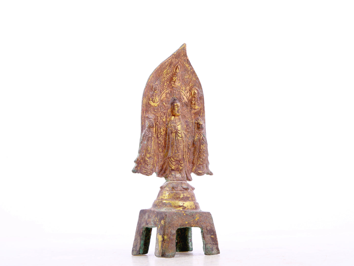 A serene gilt bronze statue of Gautama Buddha