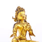 A serene gilt bronze statue of green Tara