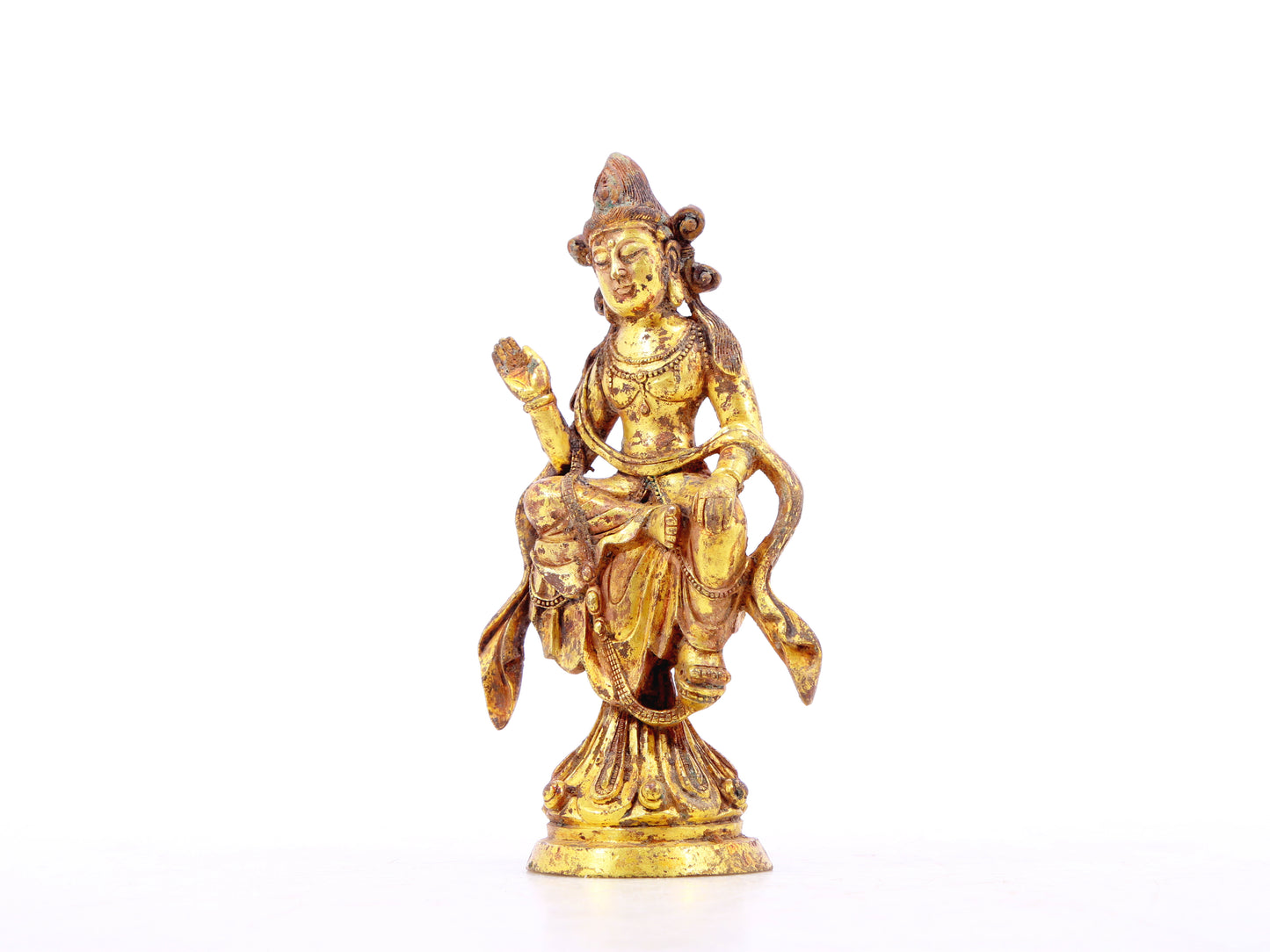 A serene gilt bronze statue of Bodhisattva