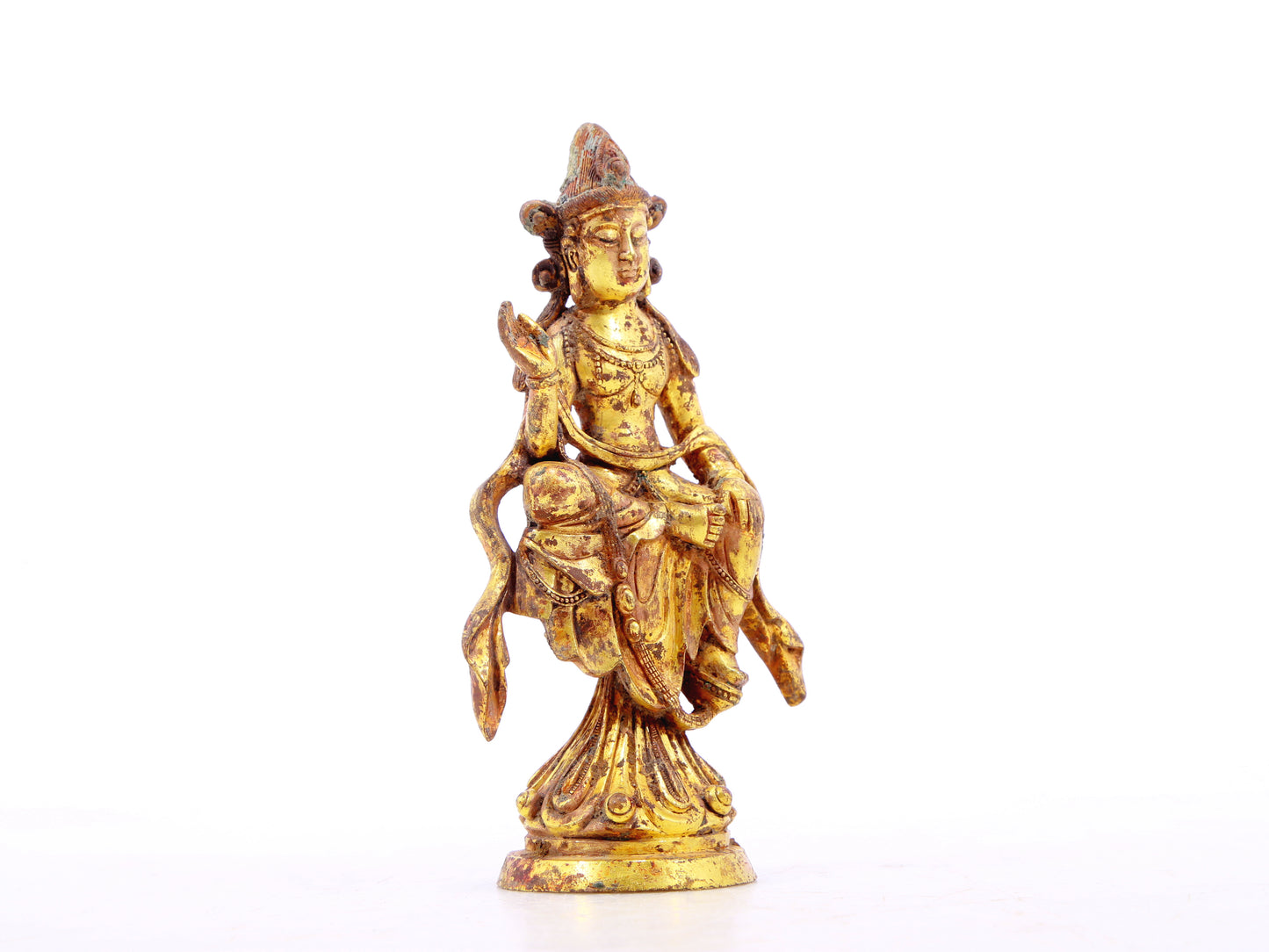 A serene gilt bronze statue of Bodhisattva