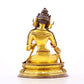 A serene gilt bronze statue of green Tara