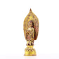 A serene gilt bronze statue of Gautama Buddha