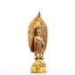 A serene gilt bronze statue of Gautama Buddha