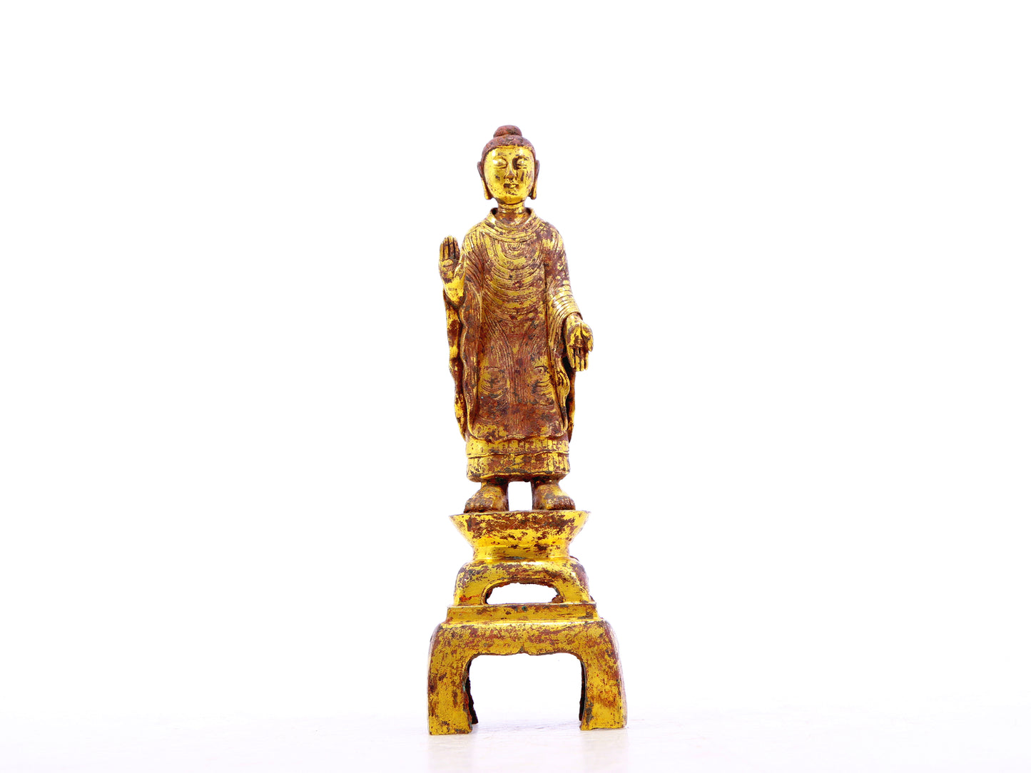 A serene gilt bronze statue of Gautama Buddha