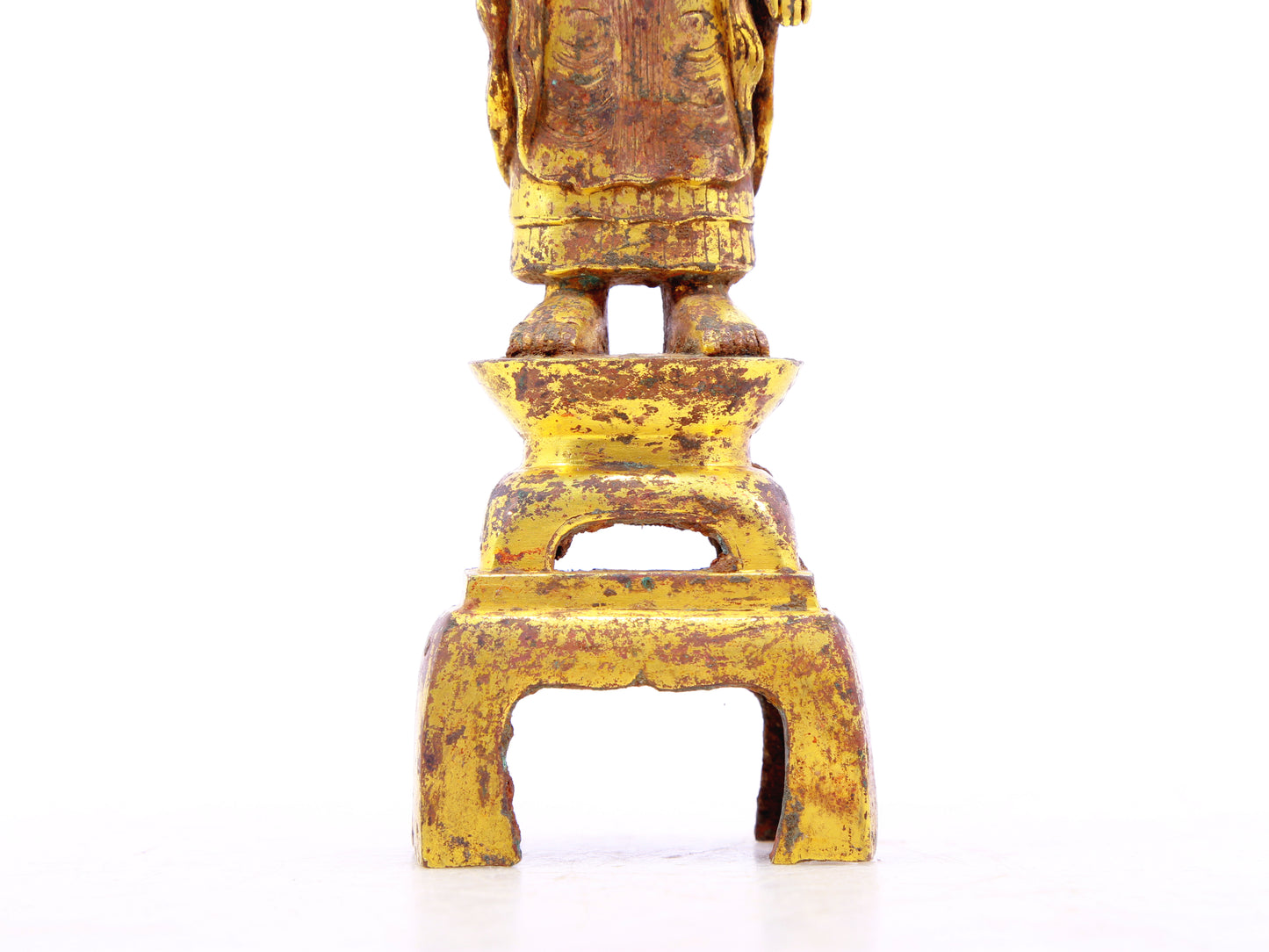 A serene gilt bronze statue of Gautama Buddha