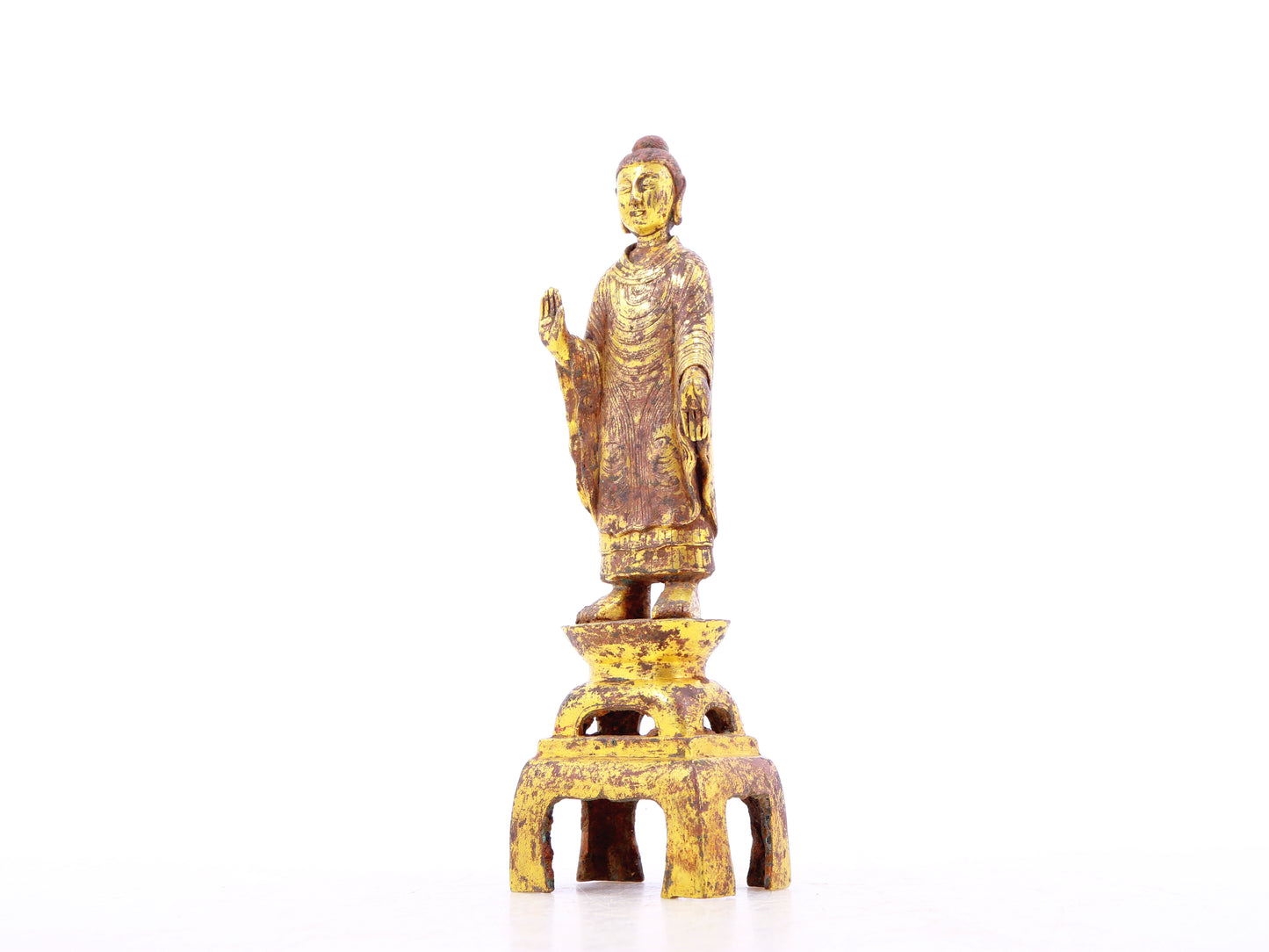 A serene gilt bronze statue of Gautama Buddha