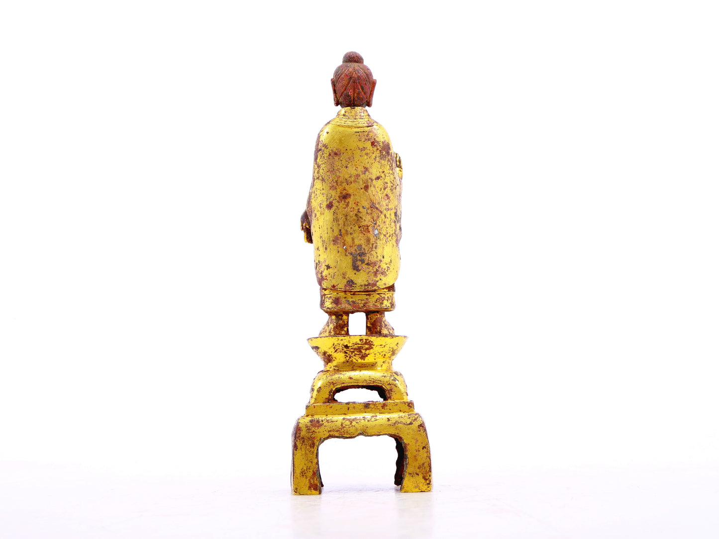 A serene gilt bronze statue of Gautama Buddha