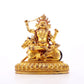 A serene gilt bronze statue of the Heavenly King inlaid with precious stones