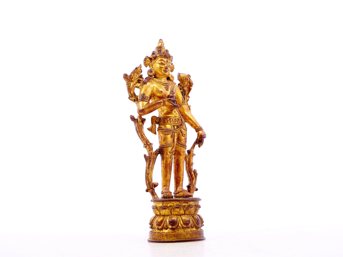 A serene gilt bronze statue of Tara