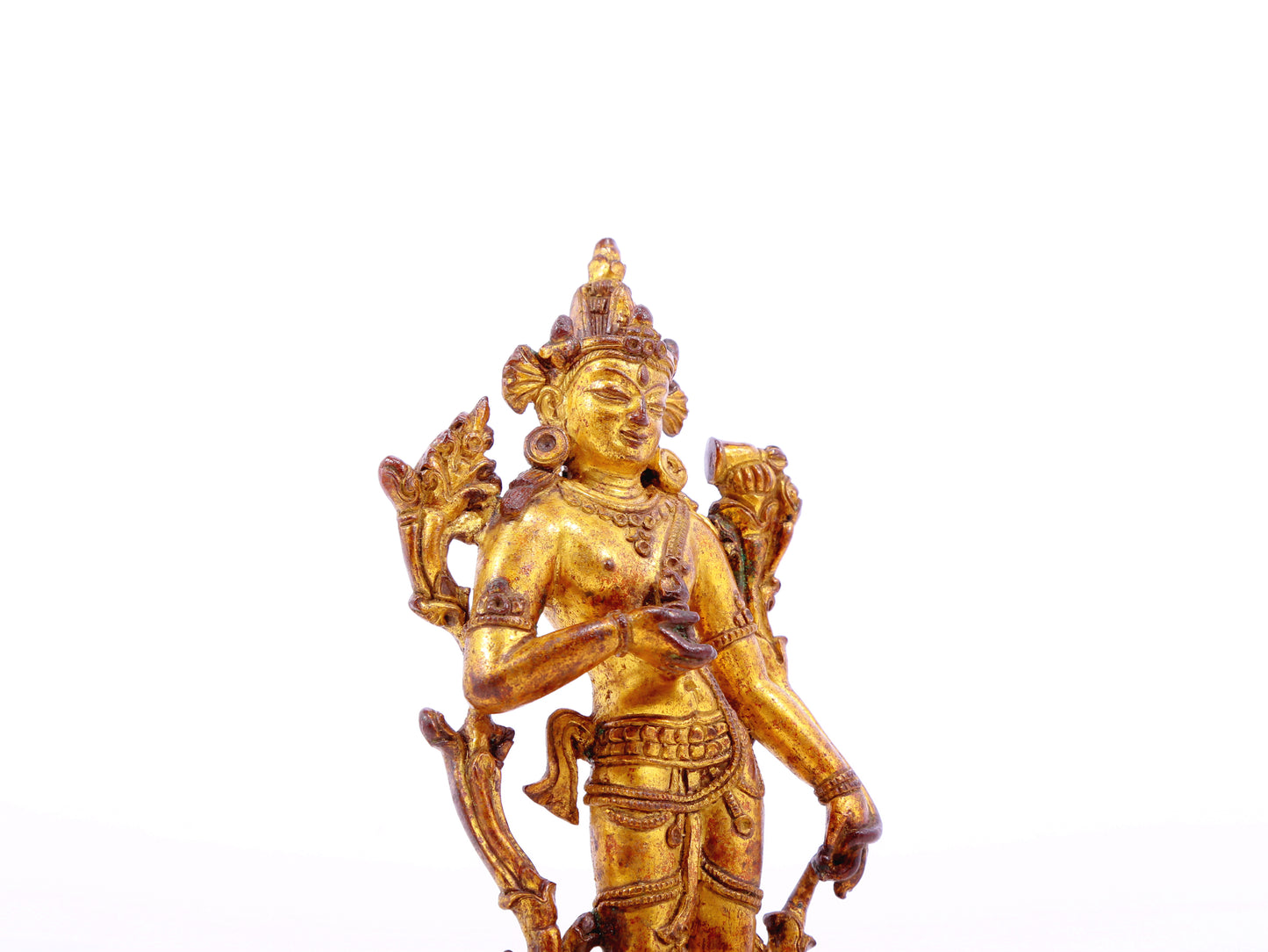 A serene gilt bronze statue of Tara