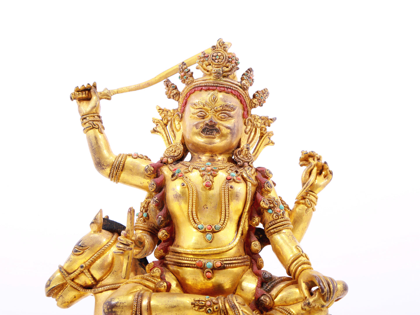 A serene gilt bronze statue of the Heavenly King inlaid with precious stones