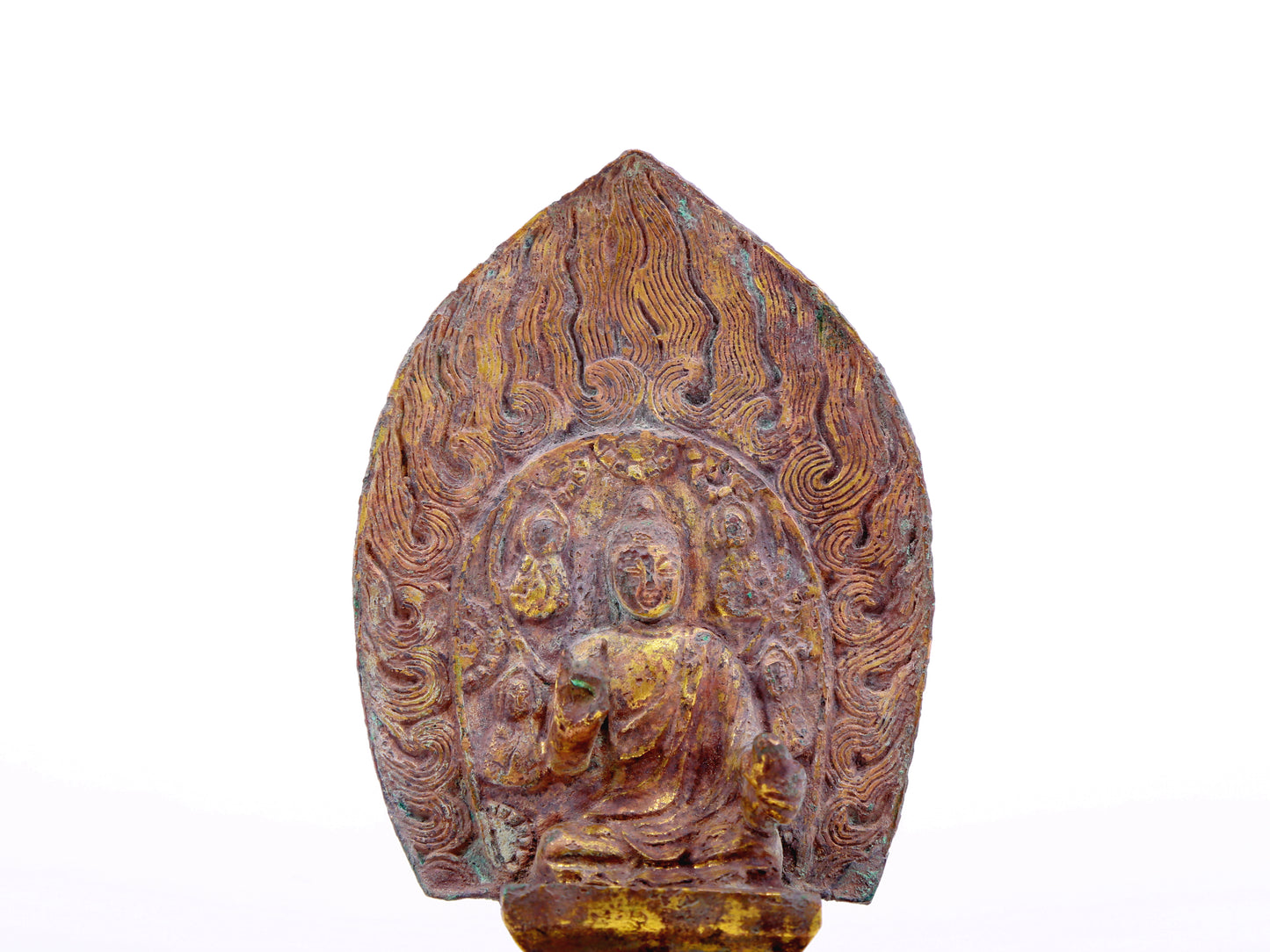 A serene gilt bronze statue of Gautama Buddha