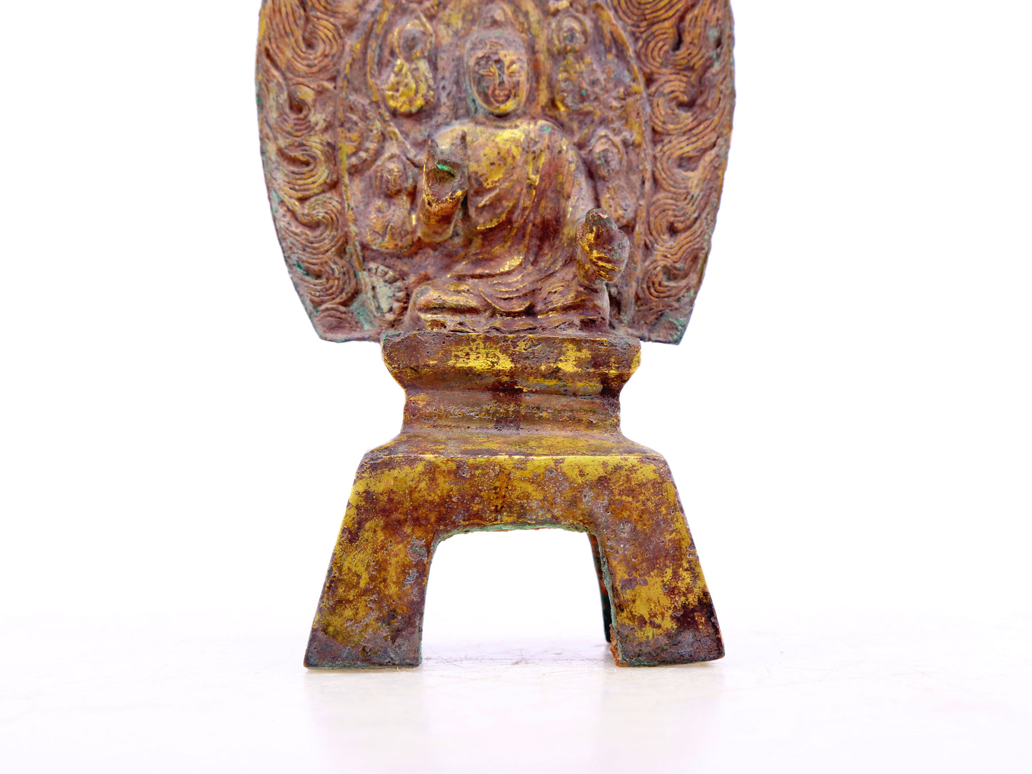 A serene gilt bronze statue of Gautama Buddha