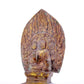 A serene gilt bronze statue of Gautama Buddha