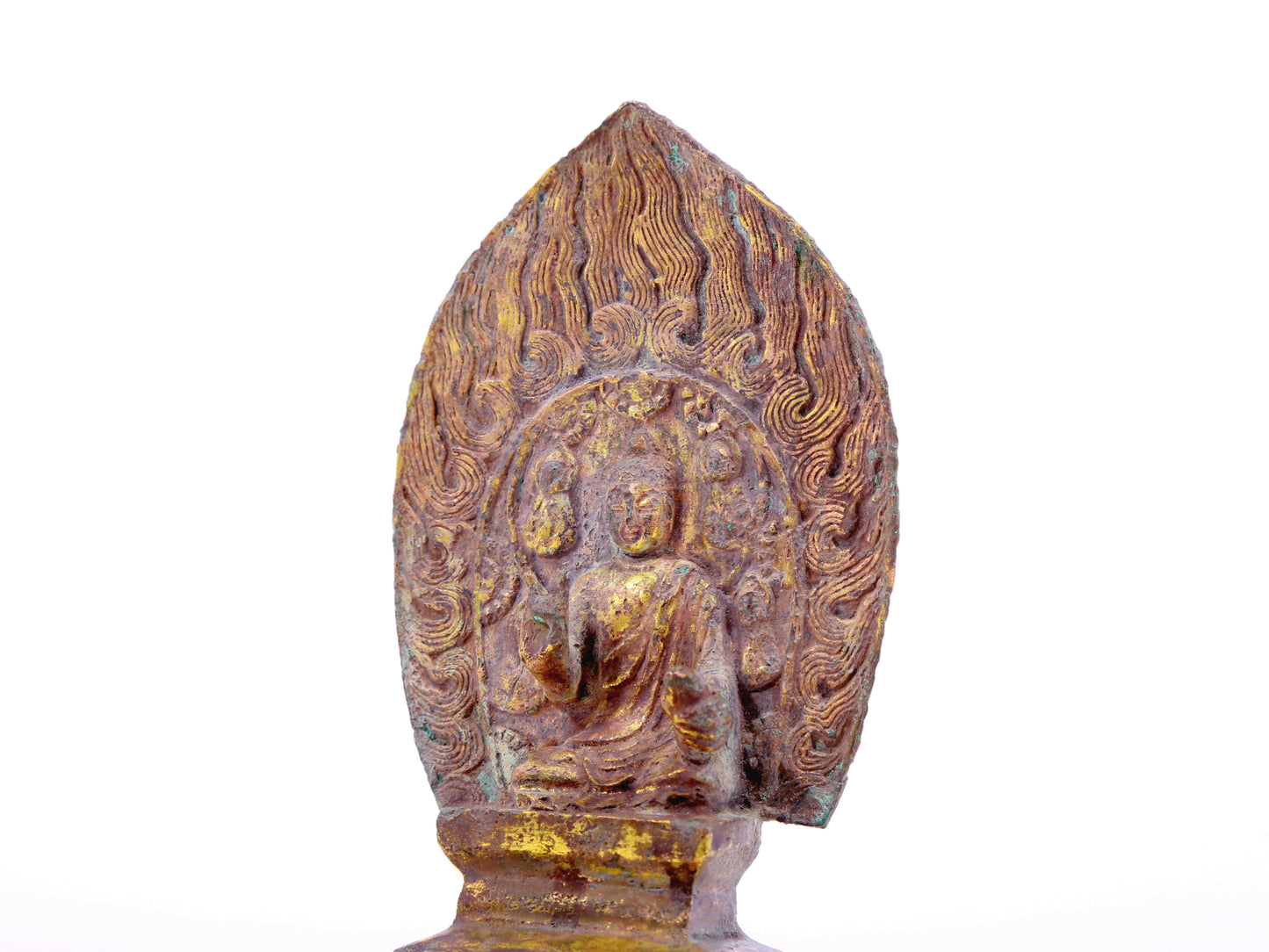 A serene gilt bronze statue of Gautama Buddha