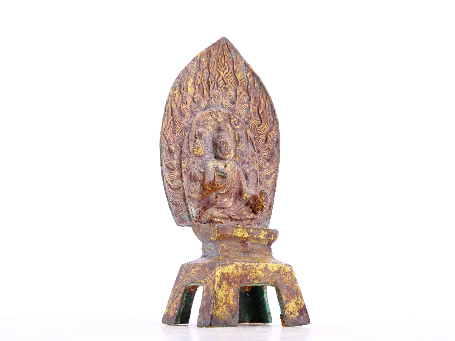 A serene gilt bronze statue of Gautama Buddha