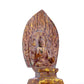 A serene gilt bronze statue of Gautama Buddha