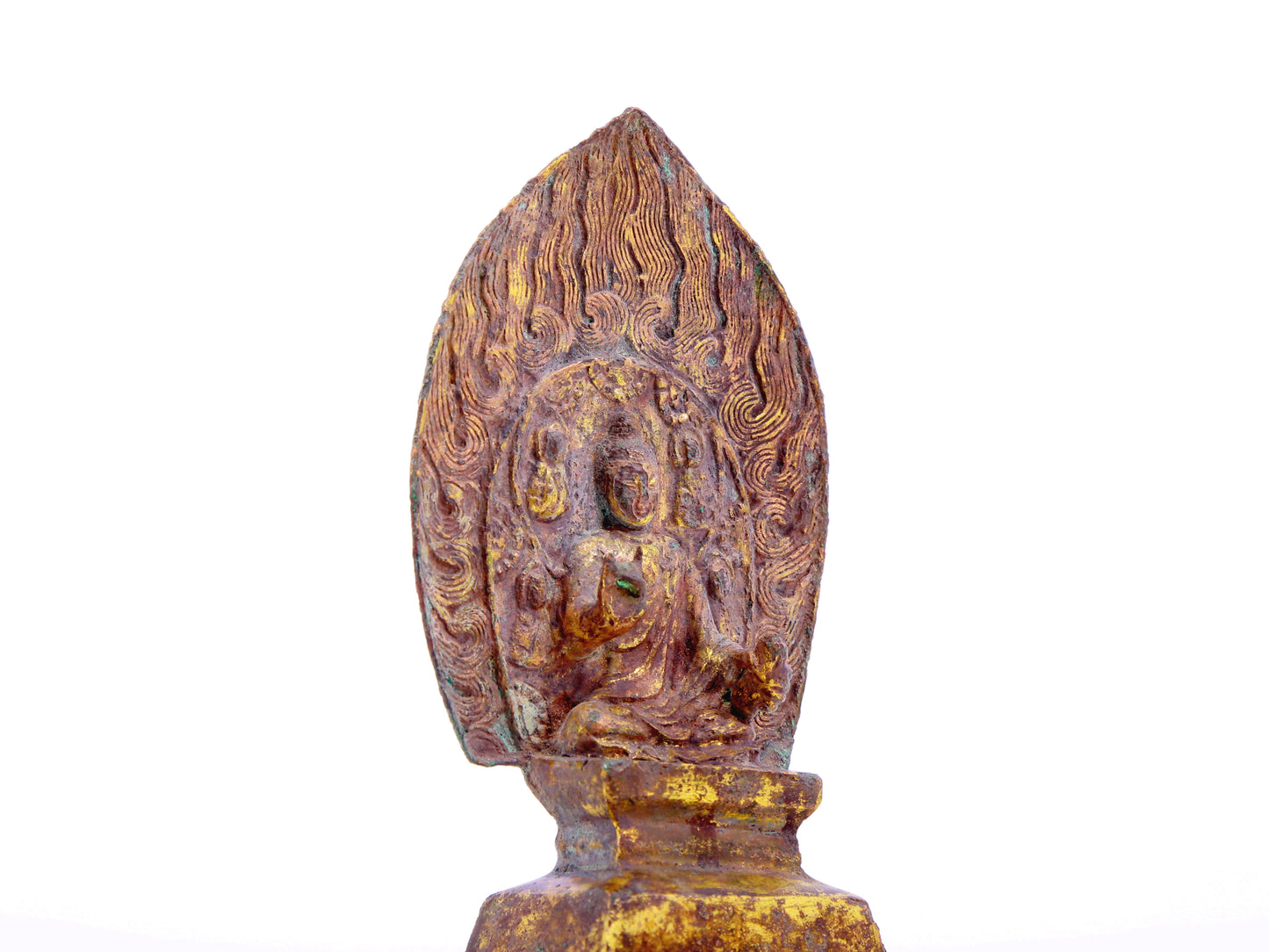 A serene gilt bronze statue of Gautama Buddha