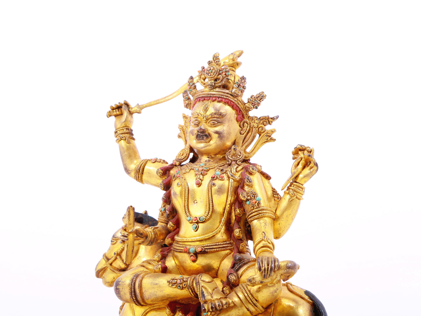 A serene gilt bronze statue of the Heavenly King inlaid with precious stones