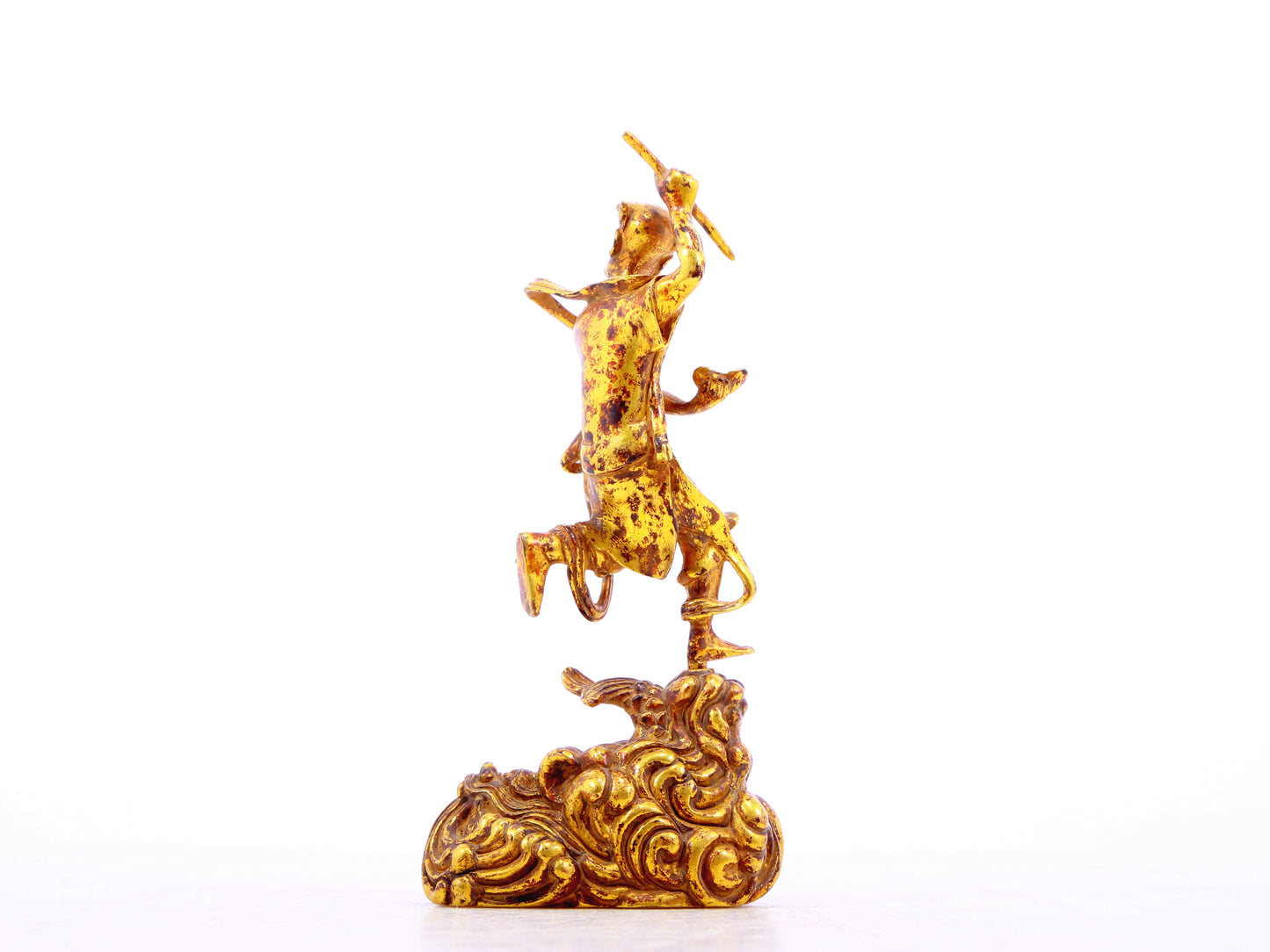 A serene gilt bronze figure