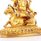 A serene gilt bronze statue of the Heavenly King inlaid with precious stones