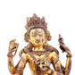 A solemn gilt bronze four-armed Guanyin statue