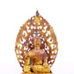 A serene gilt bronze statue of Gautama Buddha