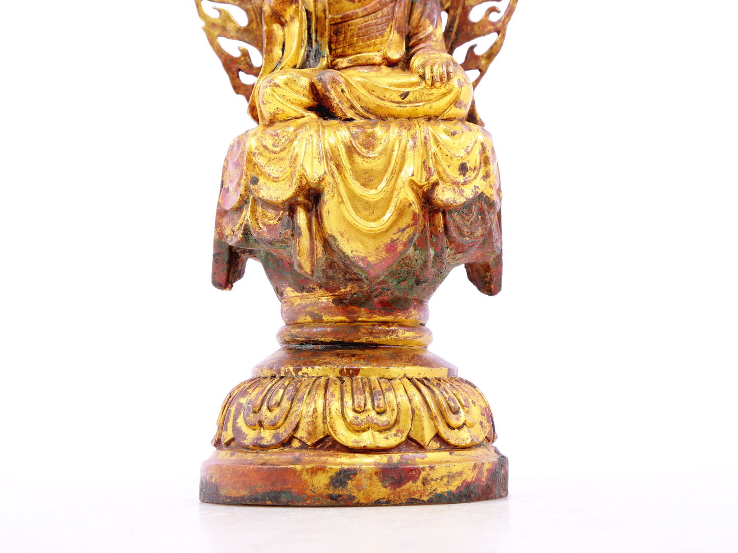 A serene gilt bronze statue of Gautama Buddha