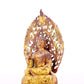 A serene gilt bronze statue of Gautama Buddha