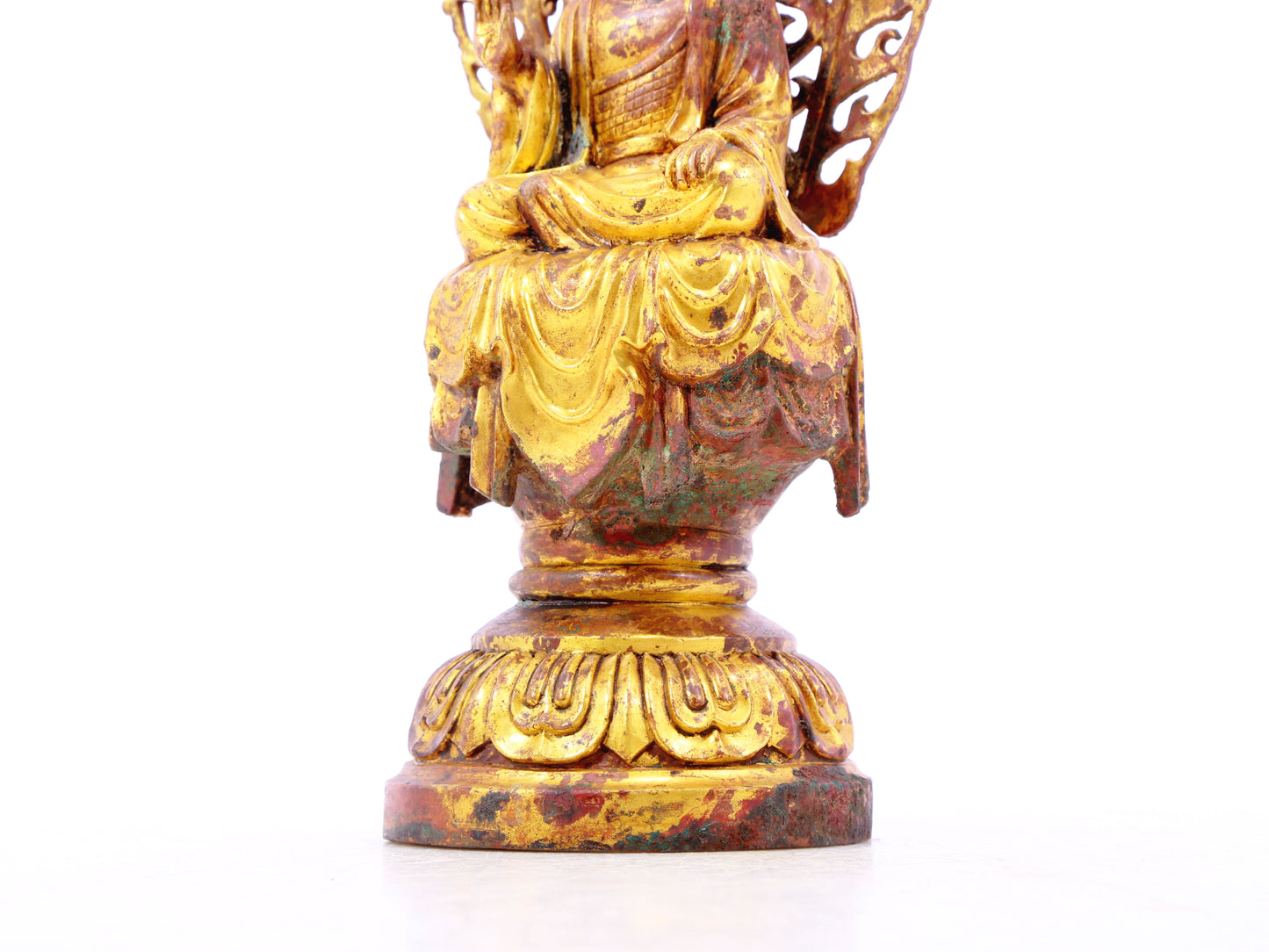 A serene gilt bronze statue of Gautama Buddha