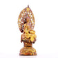 A serene gilt bronze statue of Gautama Buddha