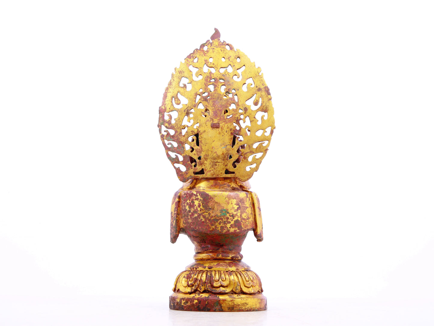 A serene gilt bronze statue of Gautama Buddha