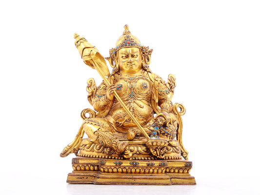 A solemn gilt bronze statue of the Heavenly King inlaid with precious stones