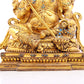 A solemn gilt bronze statue of the Heavenly King inlaid with precious stones