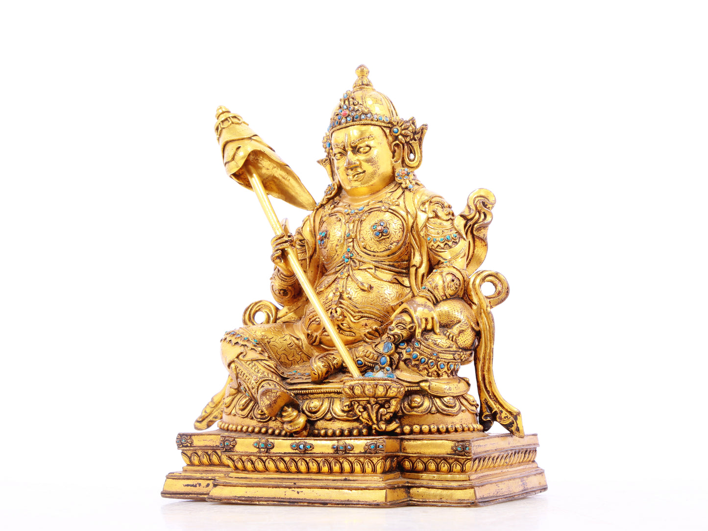 A solemn gilt bronze statue of the Heavenly King inlaid with precious stones