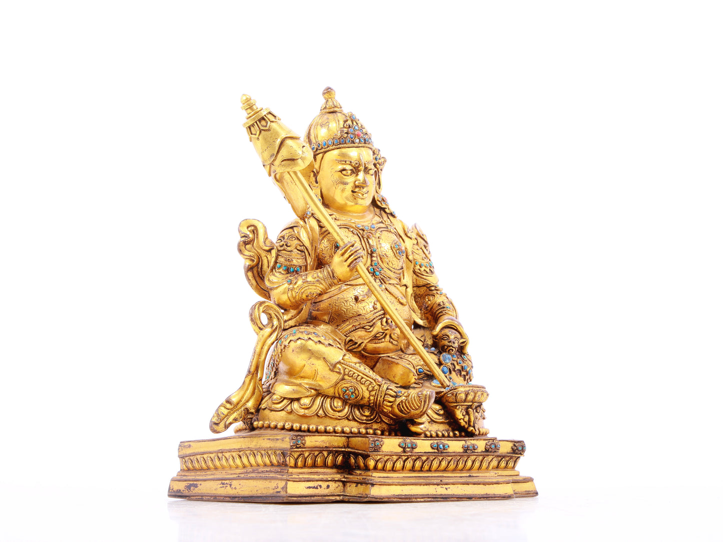 A solemn gilt bronze statue of the Heavenly King inlaid with precious stones