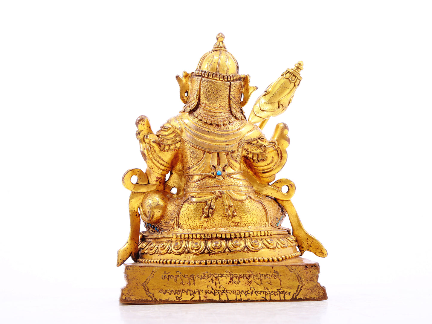 A solemn gilt bronze statue of the Heavenly King inlaid with precious stones