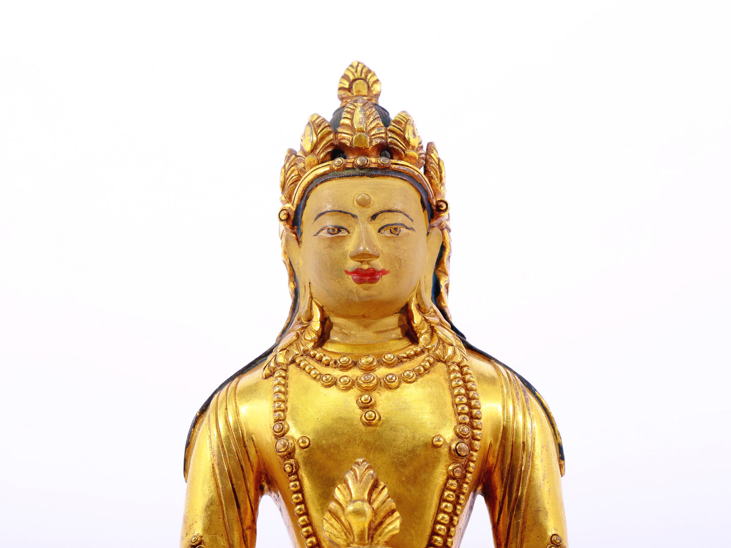 A serene gilt bronze statue of Amitayus Buddha