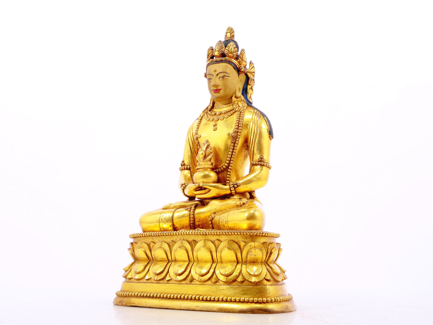 A serene gilt bronze statue of Amitayus Buddha