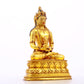 A serene gilt bronze statue of Amitayus Buddha