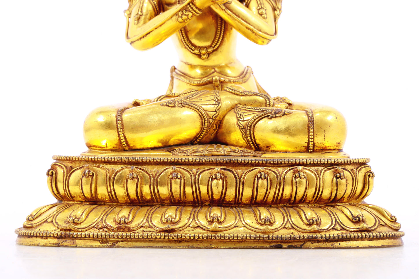 A serene gilt bronze statue of Vajrasattva