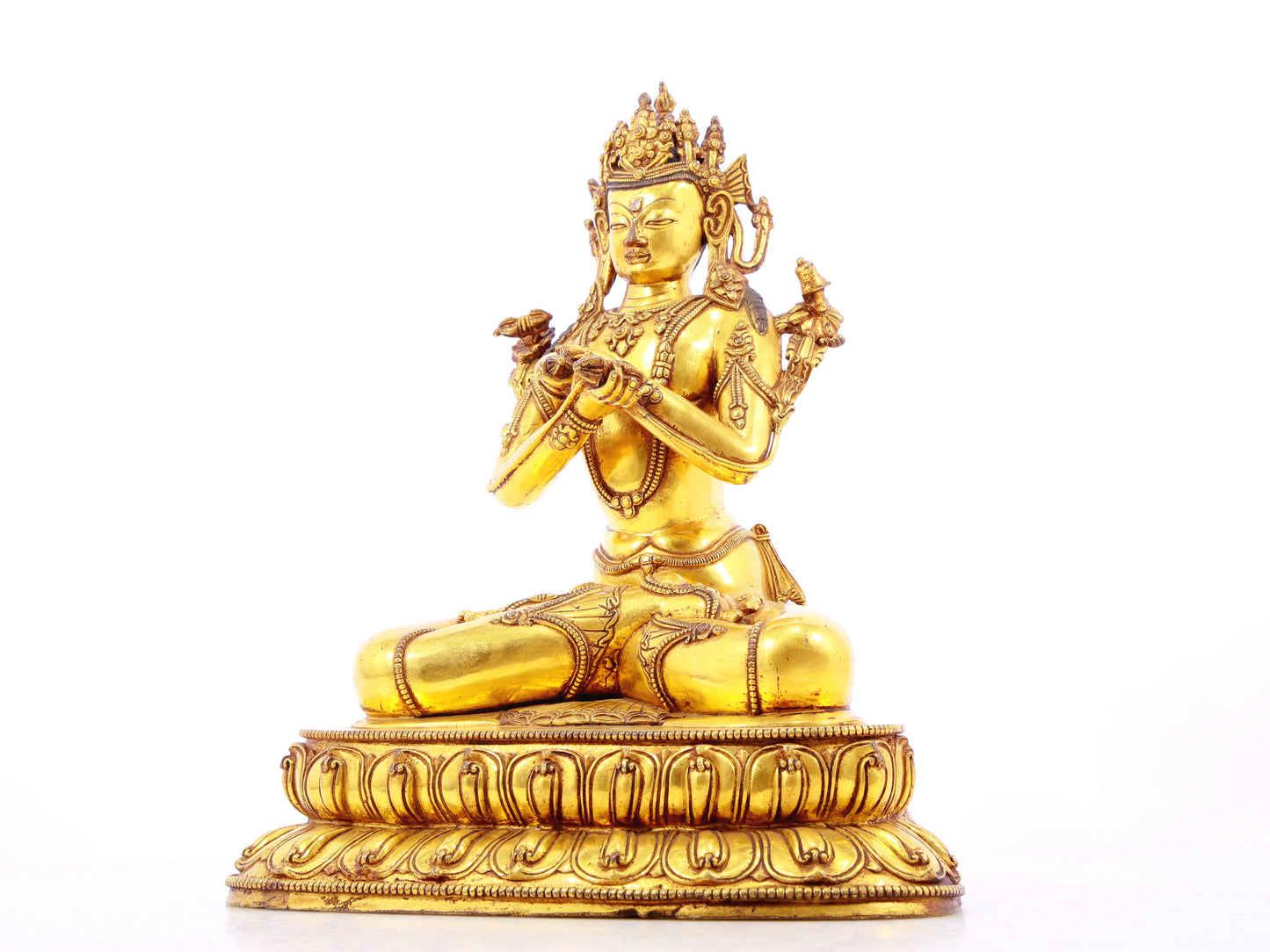 A serene gilt bronze statue of Vajrasattva