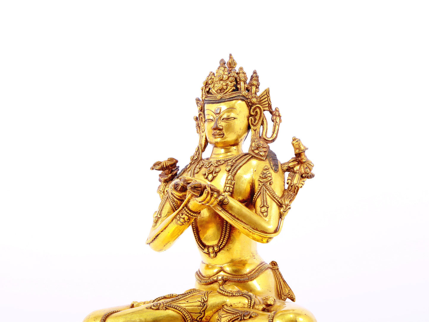 A serene gilt bronze statue of Vajrasattva